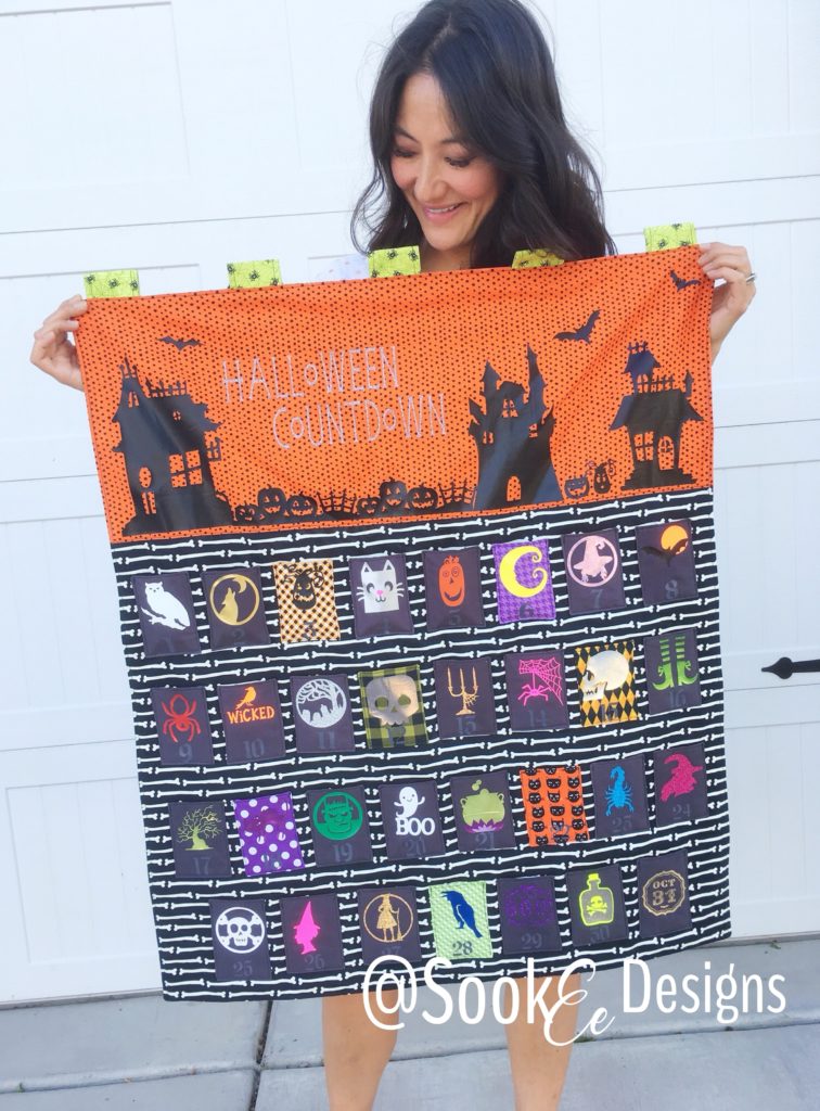 Adorable Halloween witch made of felt, scissors, thread set, orange, beige  and black felt sheets on wooden background with copy space for text.  Halloween crafts idea for kids. Inspiration crafts Stock Photo